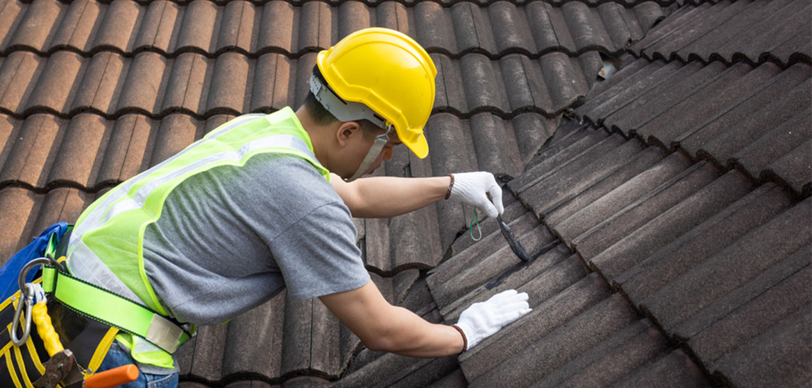 What Actions Should You Take After Filing A Wind-Damaged Roof Insurance Claim?